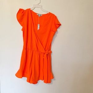 NWT Side tie romper w/ ruffles on sleeves and legs